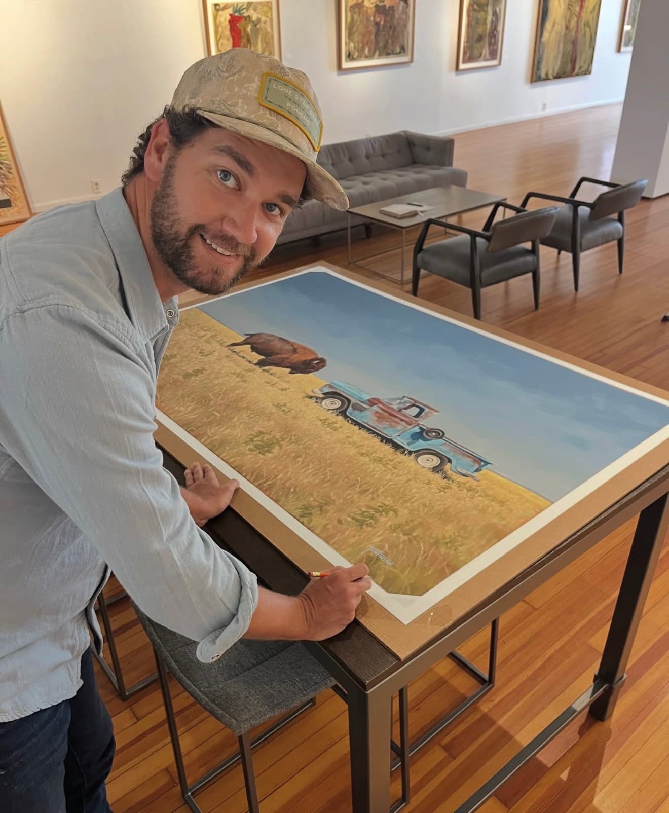 artist Matt Tumlinson with one of his artworks
