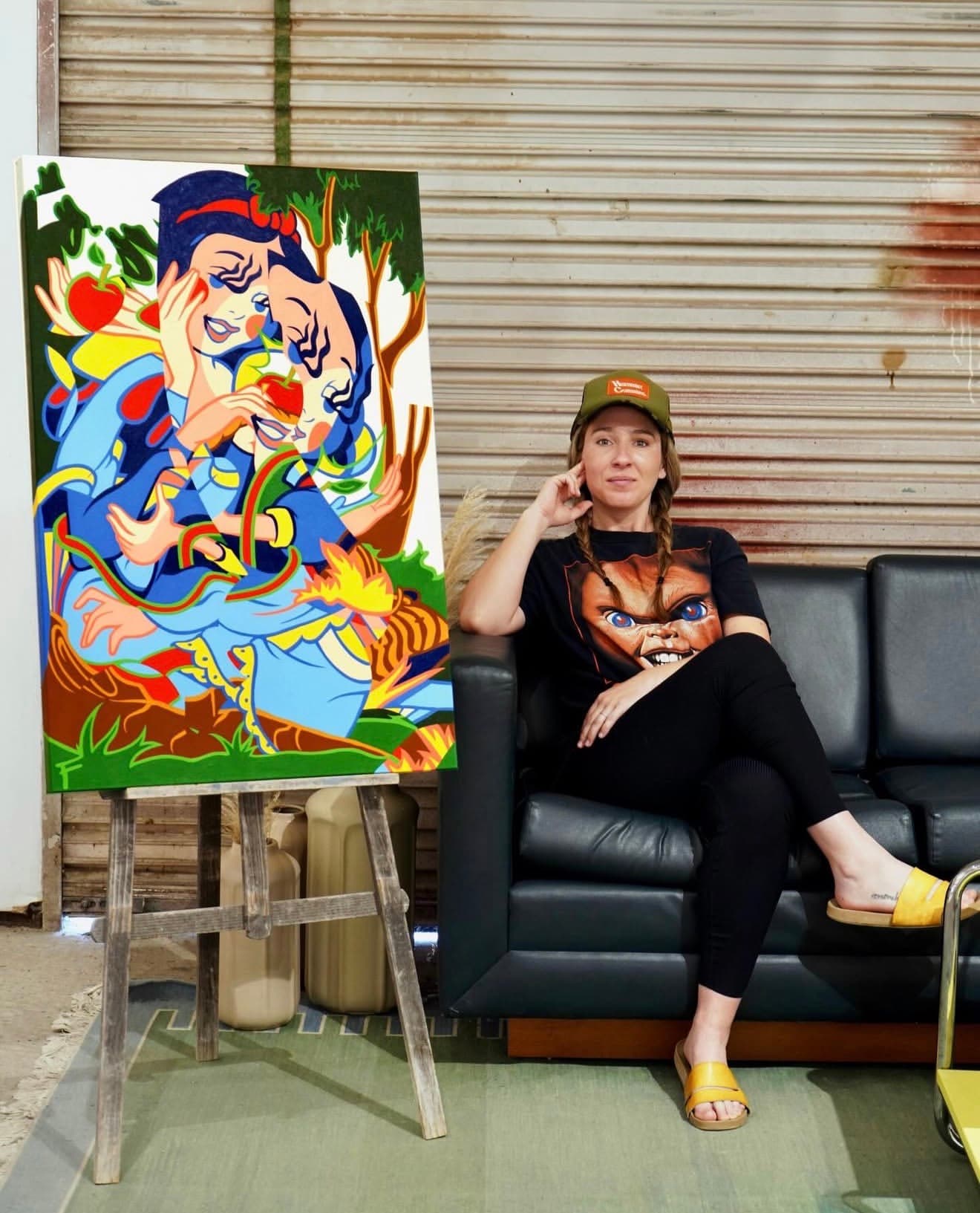Artist FeeBee with one of her artworks