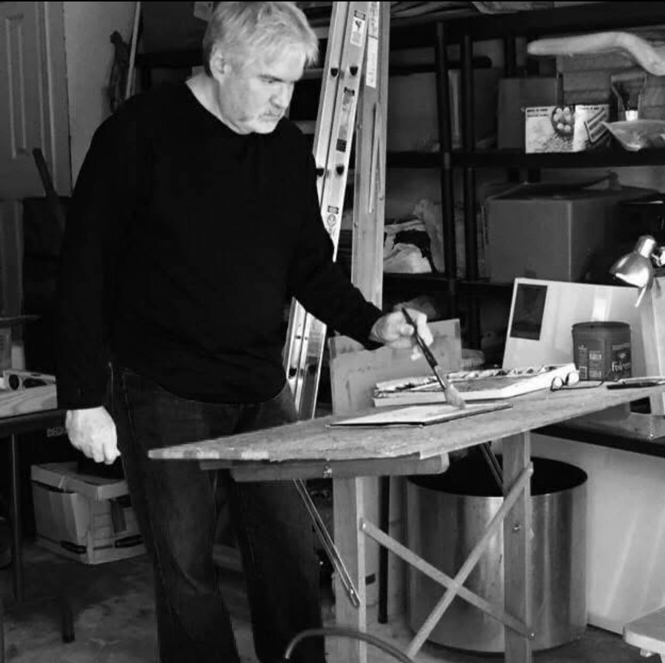 portrait of artist Lee Adami painting