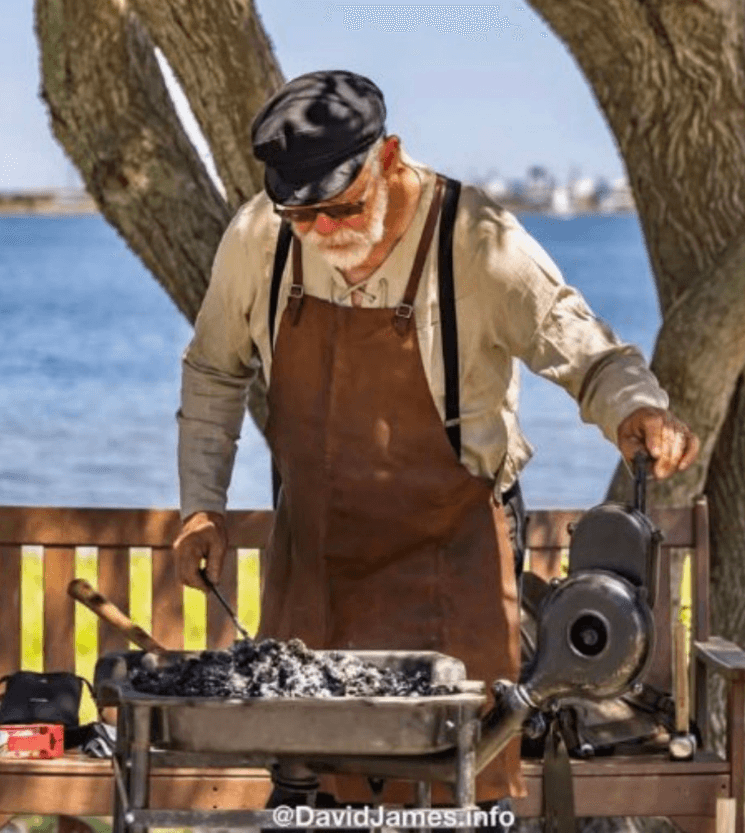 Mickey Redus showcasing traditional blacksmithing techniques