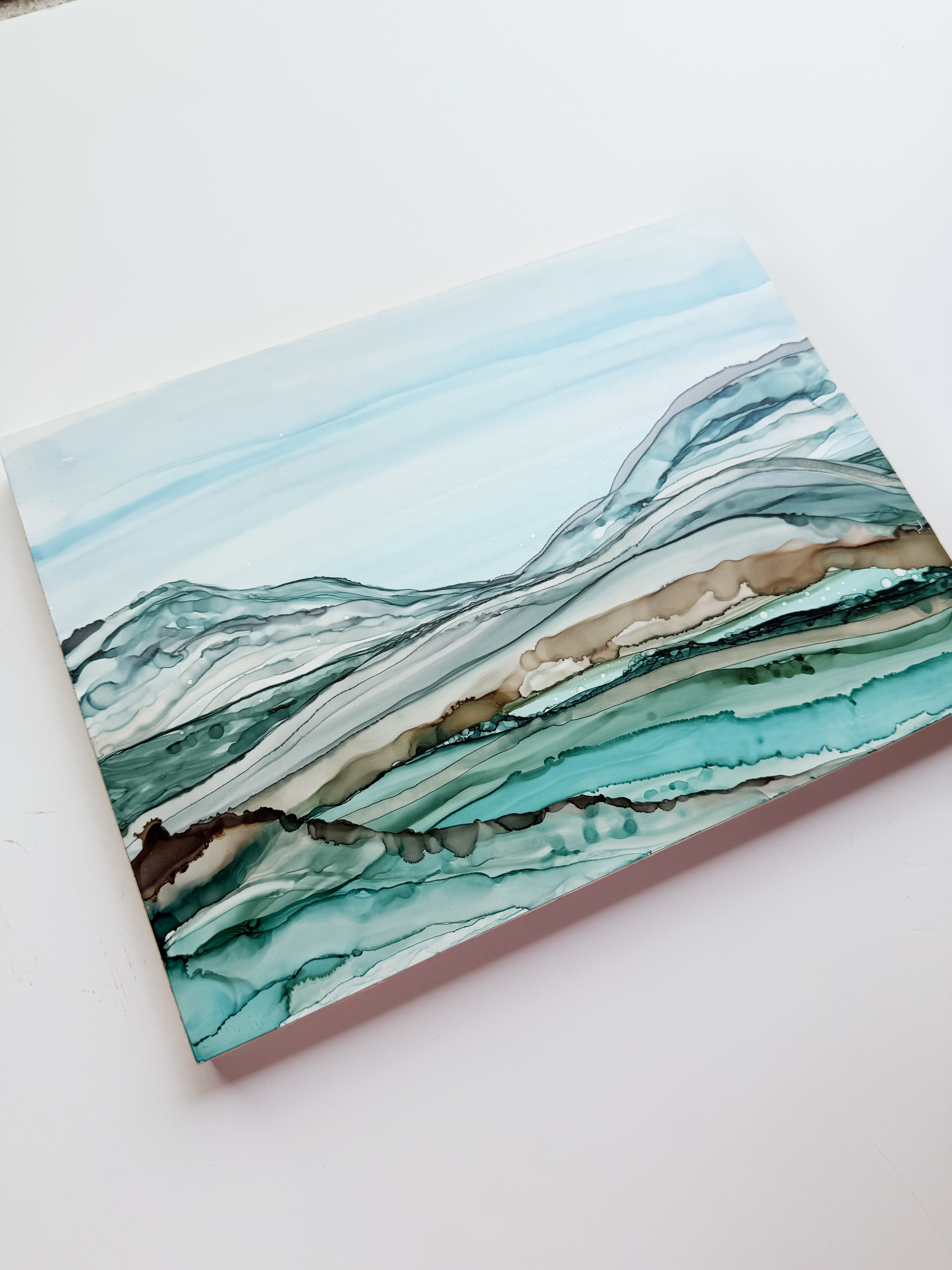An painting of blue and brown wave-like designs