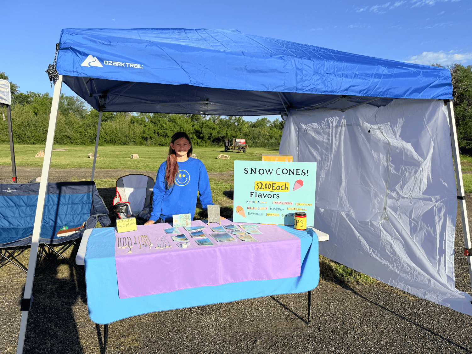 Reagan Fry selling her jewelry, art and snow cones